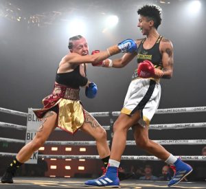 Flalhi lands a right cross flush on Rushton